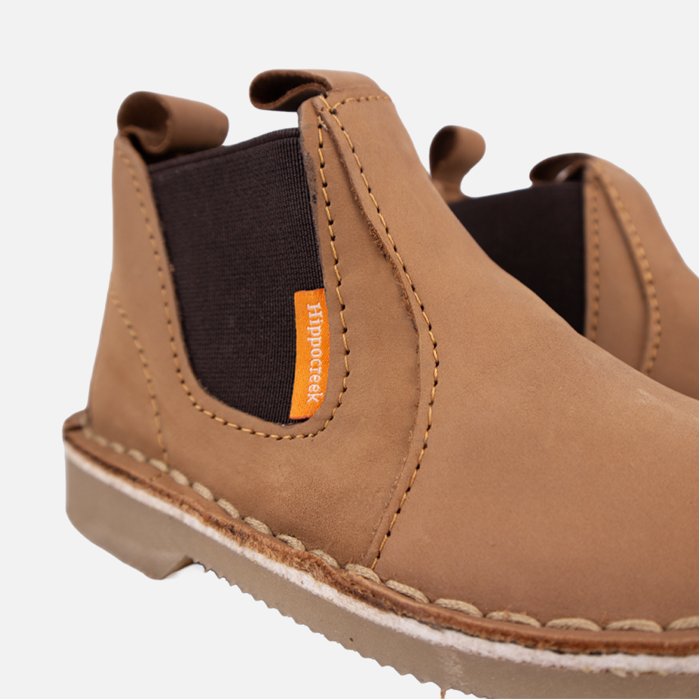 Close-up view of the elastic side gusset and dark chocolate genuine leather of the HippoCreek Kids Possum Slip-On Boot