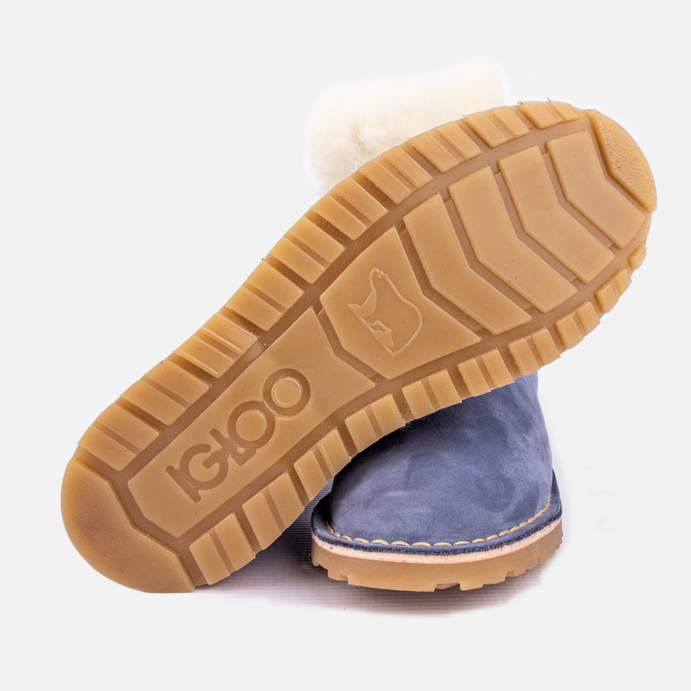 Detail view of the Igloo Tundra Boot in blue, showing the branded sole and sheared sheeps and lambswool lining and collar.