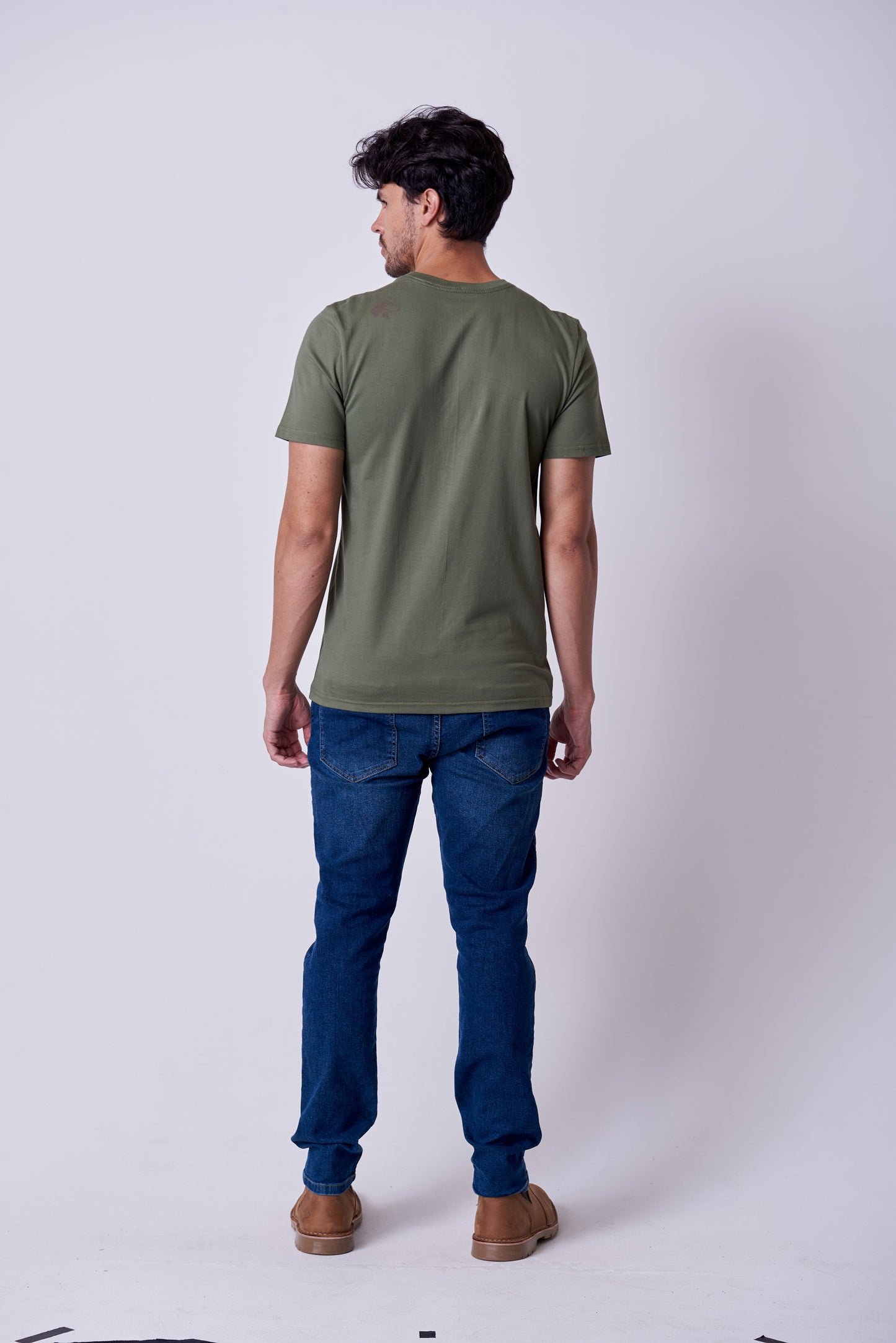 Rear view of the Wolf Rock Ryder Printed Tee in burnt olive, showing the subtle logo branding on the back shoulder.