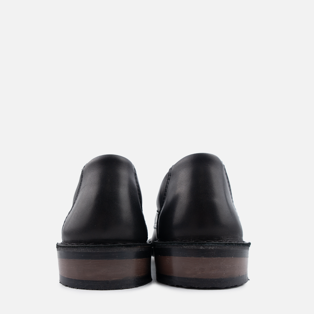 A pair of Wolf Rock mens formal Archer shoe, shown from the heel.