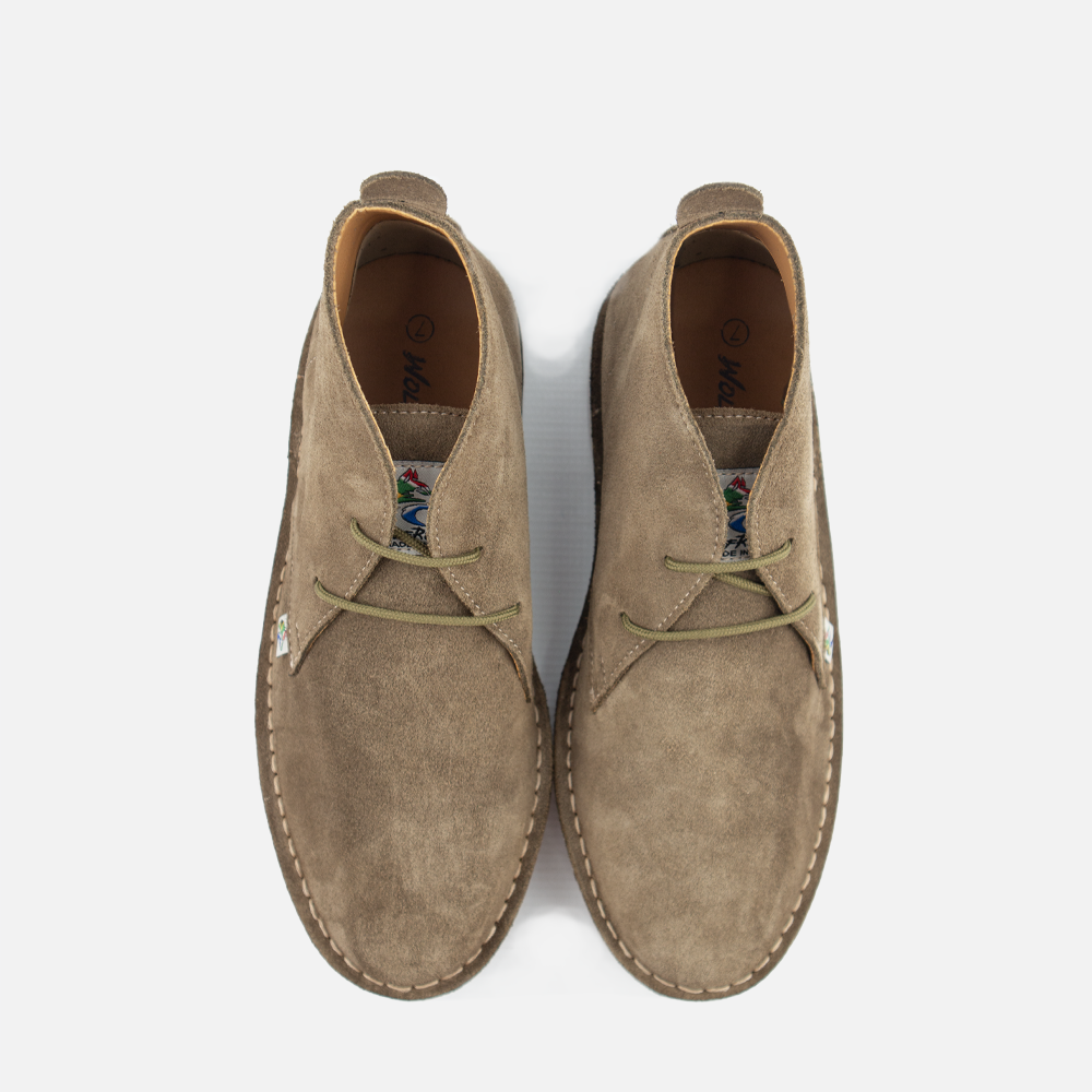 Top View of a  pair of Wolf Rock Made in ZA traditional mens veldskoen style boots in olive suede, with olive green laces, displayed on a clean white background.