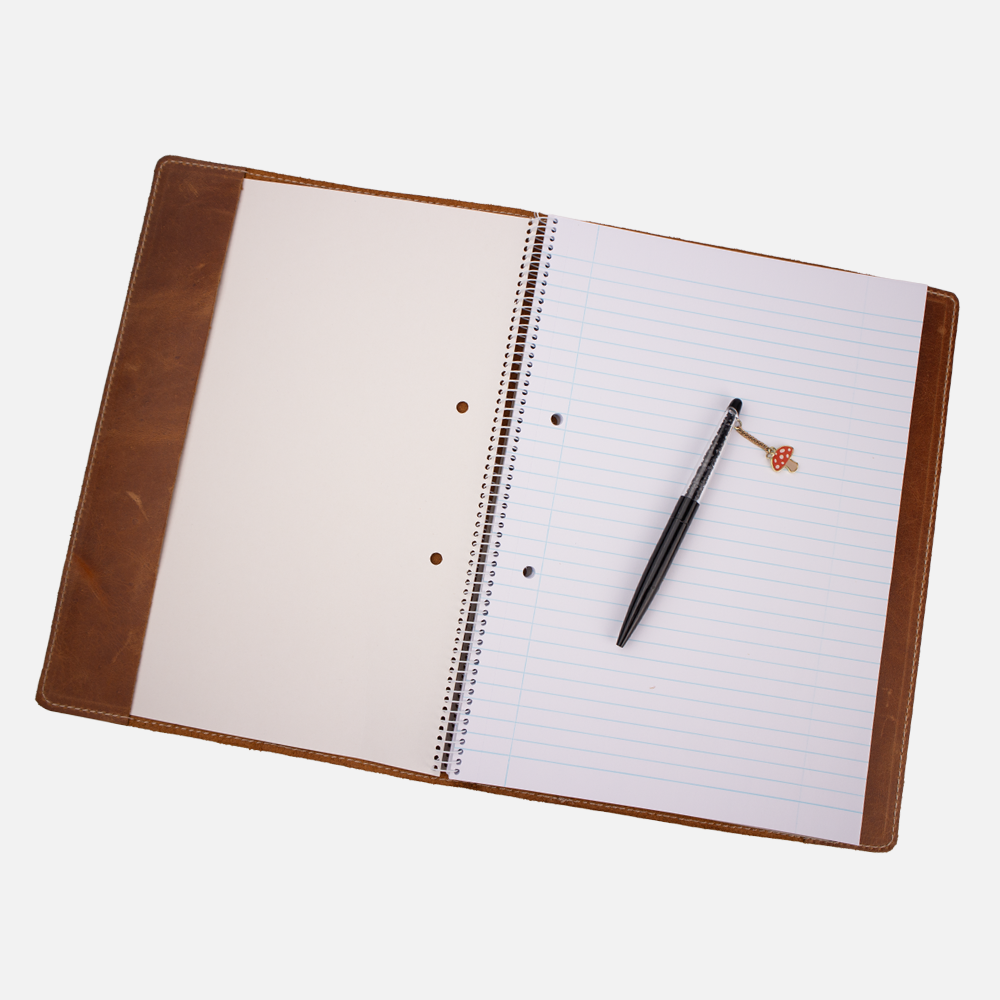 Open view of the Tan leather notebook cover, showing how a standard A4 notebook is fitted inside.