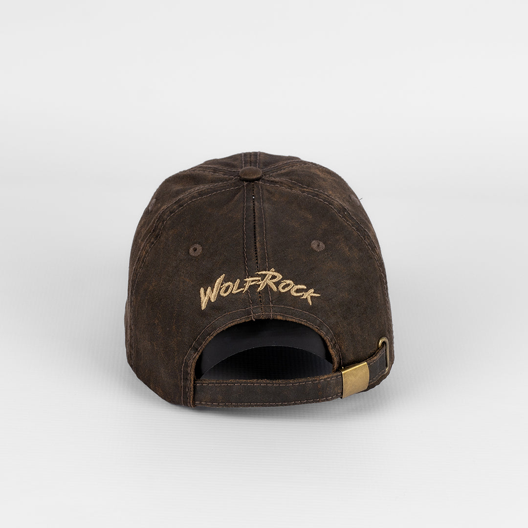Rear view of the Wolf Rock Brown Oil Skin Cap showing the back logo embroidery and adjustable strap and clasp. 