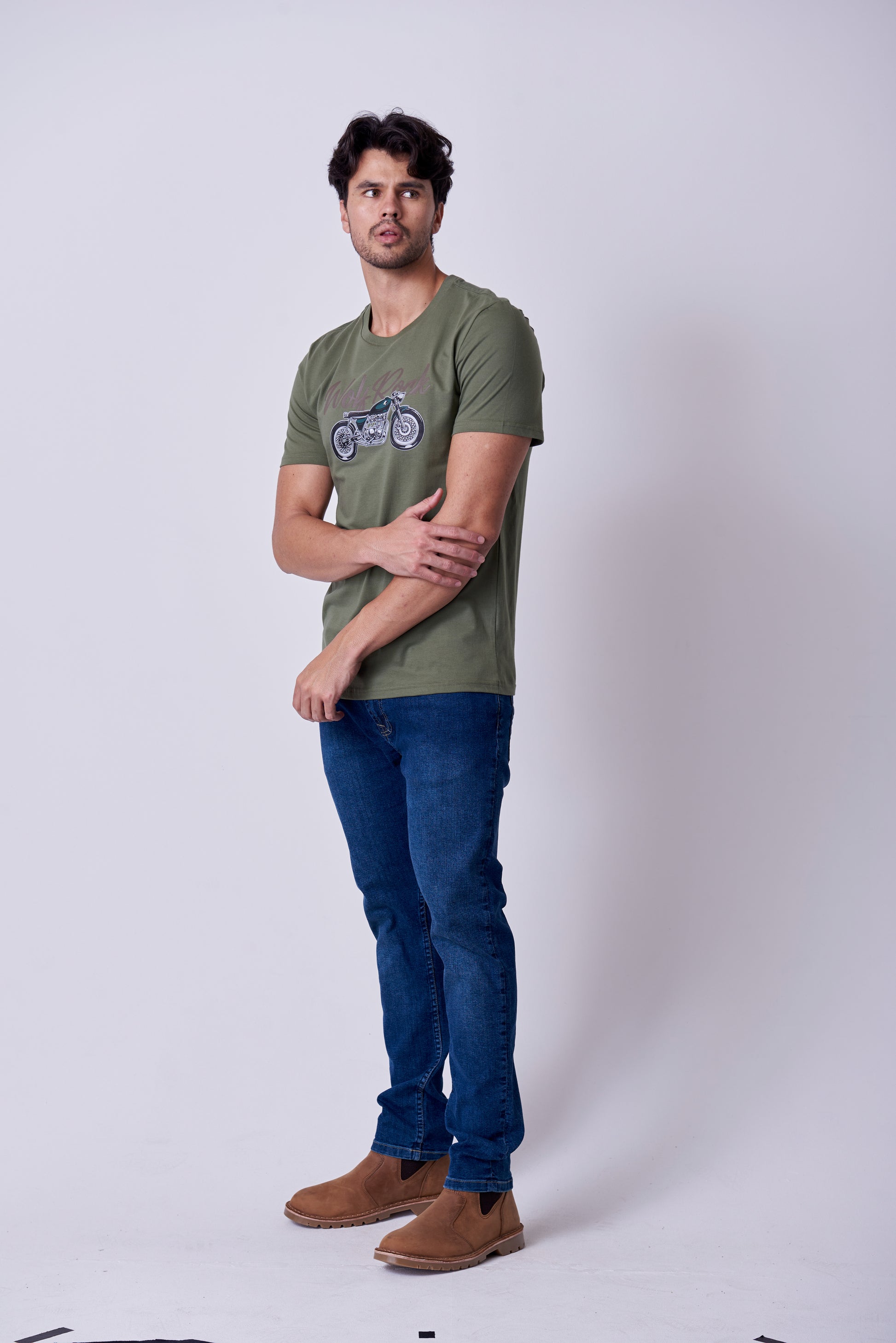 Close-up of the durable vintage graphic print on the Burnt Olive Wolf Rock T-shirt.