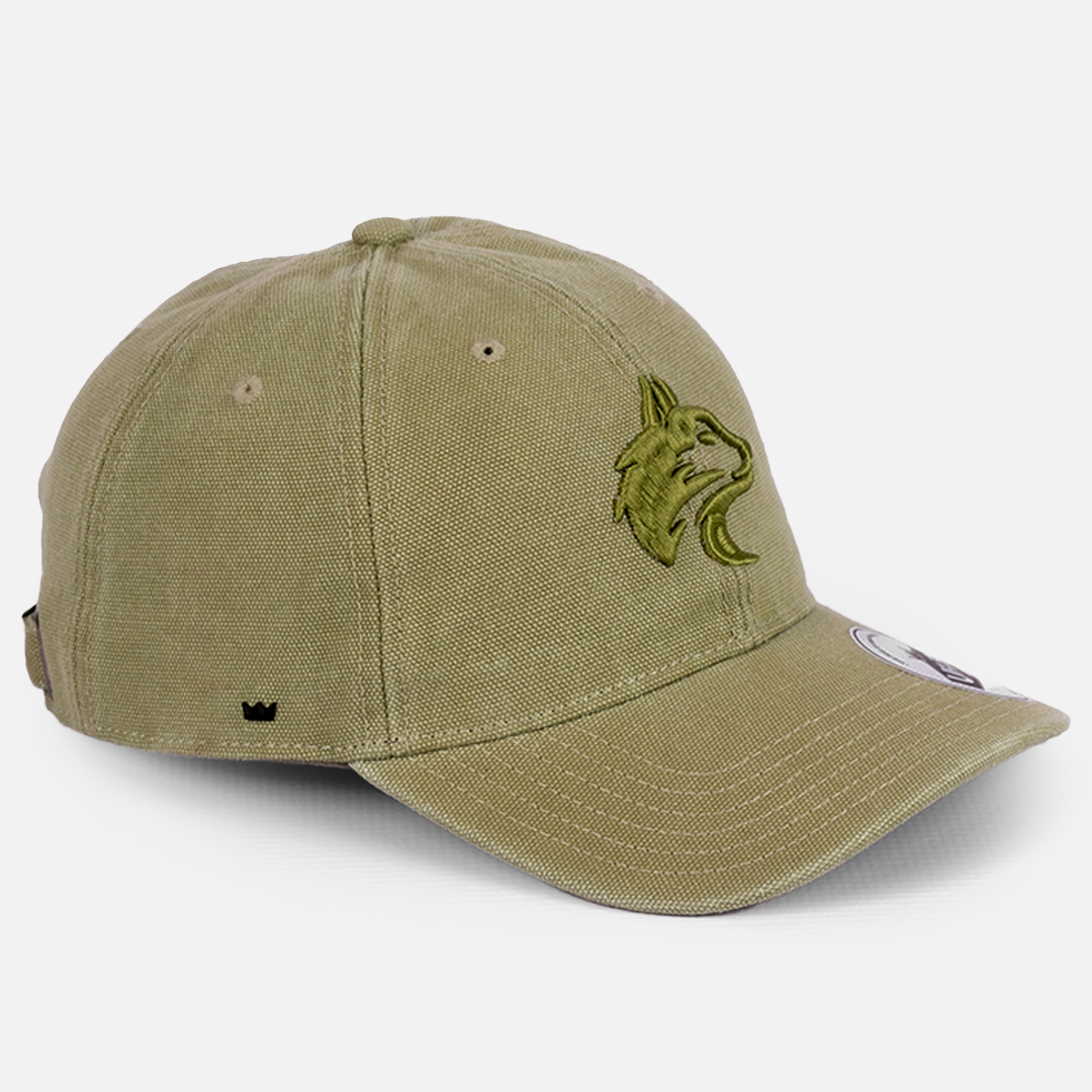 Close-up detail of the durable Canvas fabric texture on the Wolf Rock Canvas U-Flex Green cap.