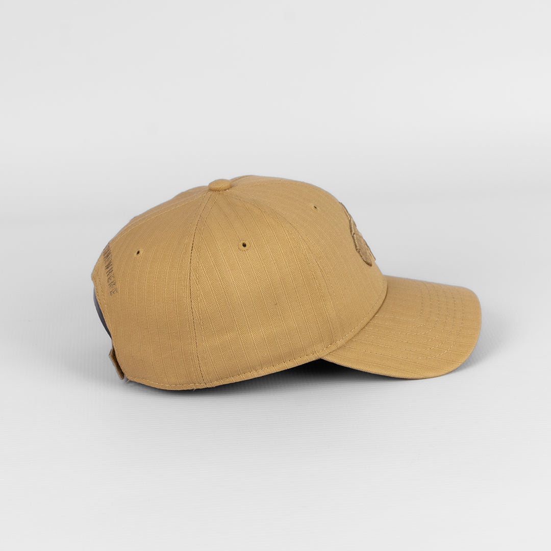 Close-up detail of the durable, textured cotton/canvas material on the Khaki cap.