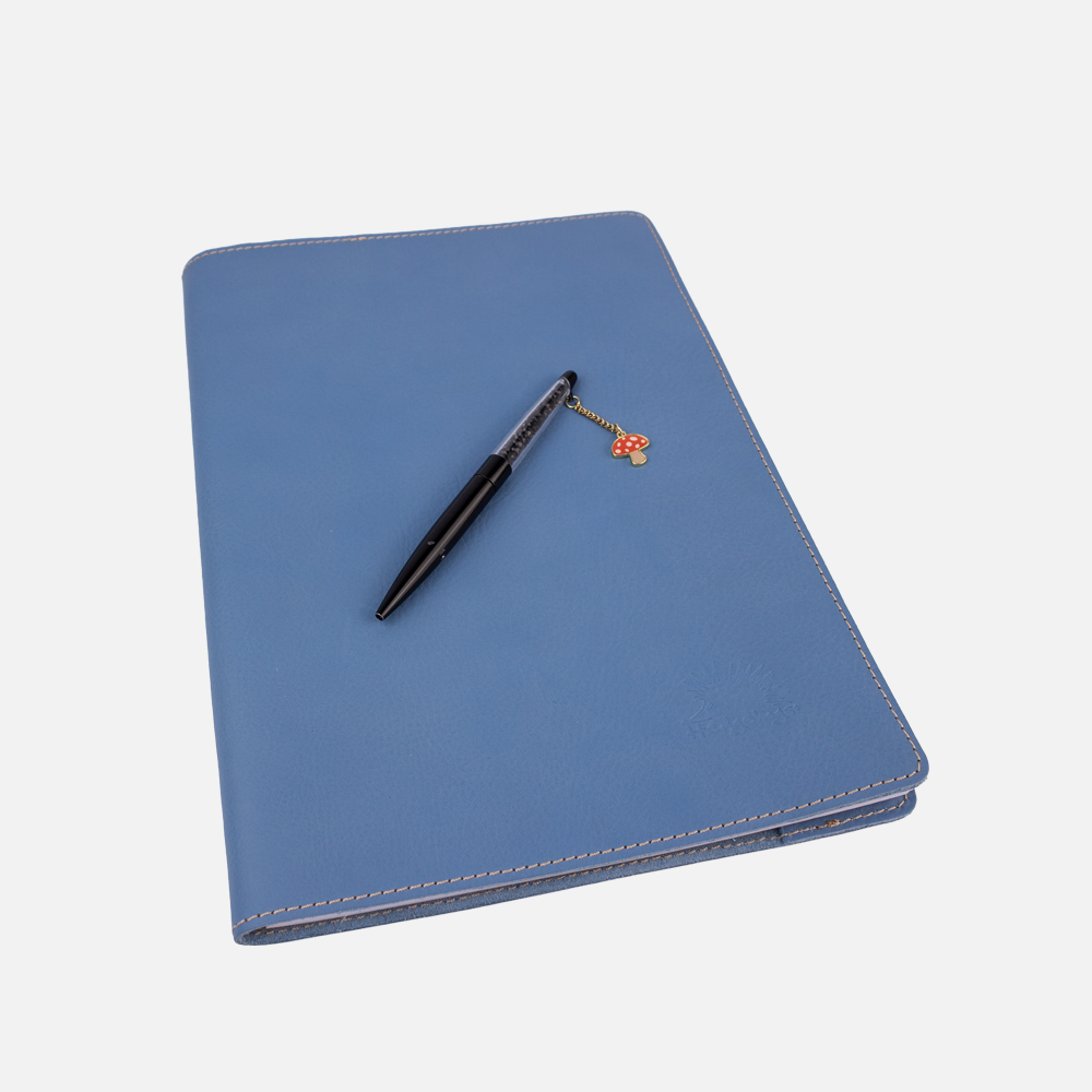 Side view of the Hedgehogs ladies A4 full grain leather notebook cover in baby blue