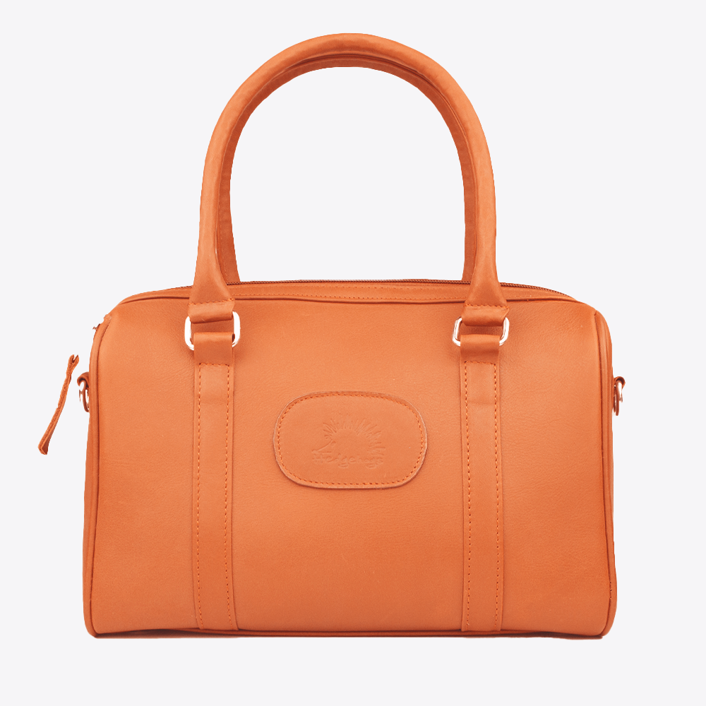 Front view of the Hedgehogs Bowler Bag in Coral Leather, a classic women's structured handbag.