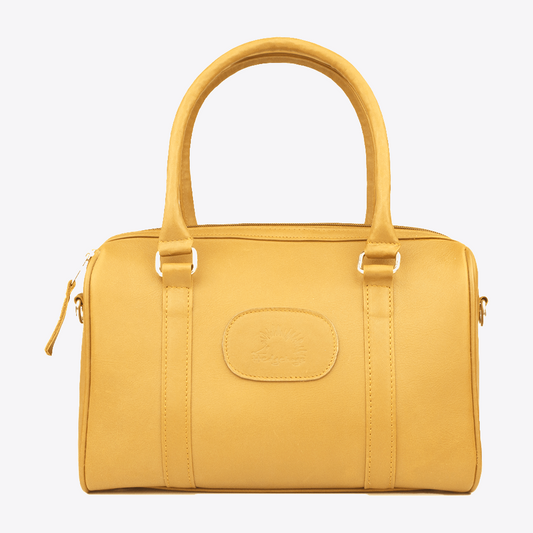 Main view of the Hedgehogs Ochre Leather Bowler handbag showing handles and front logo embossing. 