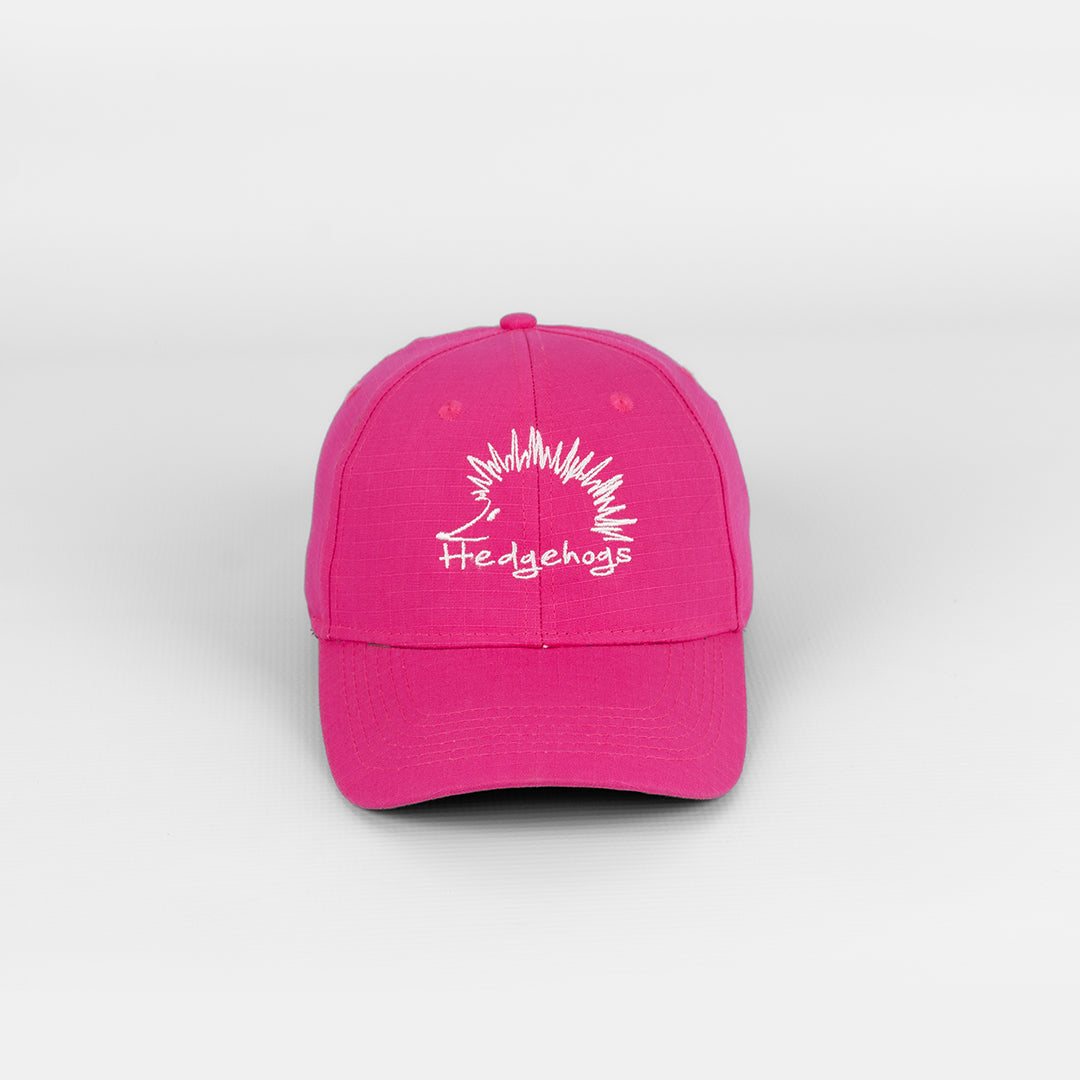Front view of the Hedgehogs Ladies Cerise Rip Stop Cap, featuring subtle white logo embroidery. 