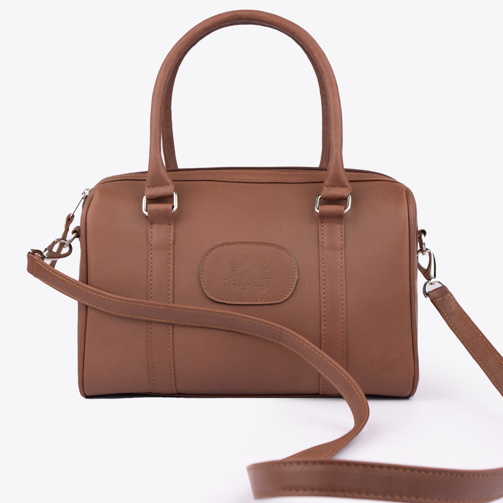 View of the Hedgehogs Bowler handbag in chocolate brown showing the detachable crossbody strap