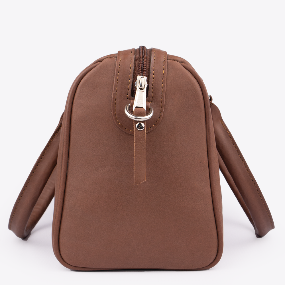 Side view of the Hedgehogs Bowler Handbag in rich chocolate leather showing side and zip detail.