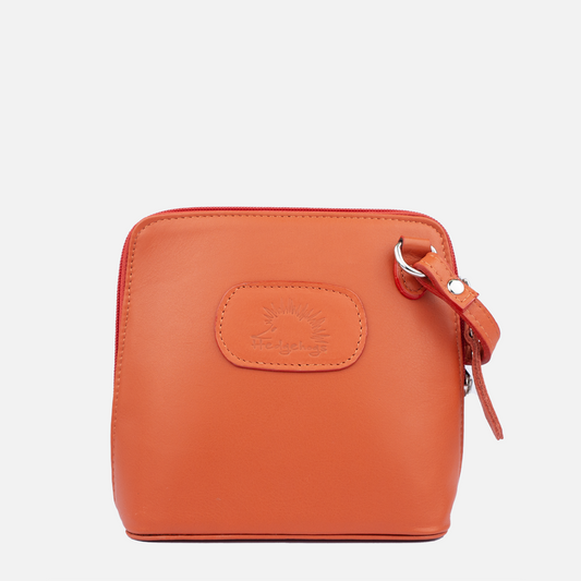 Front profile of the Hedgehogs coral clutch bag with a zipper and a brand logo embossed on the front.