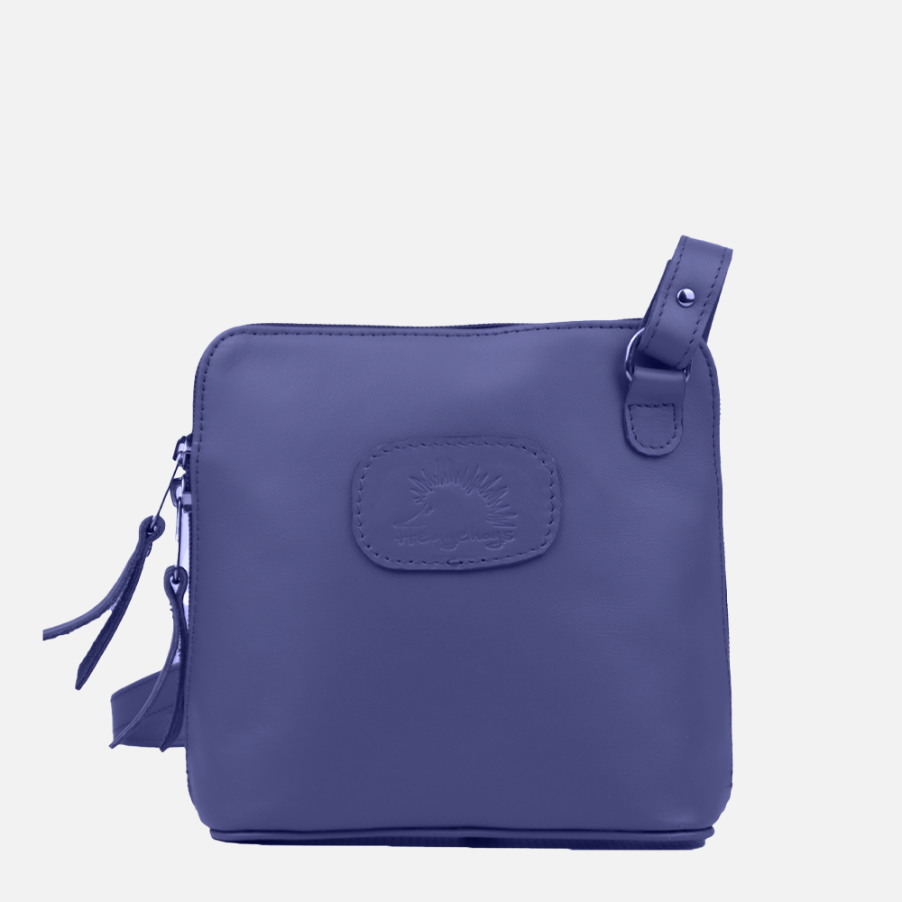 A clutch bag in indigo color with a visible brand logo on the front, a strap on the top right, and a tassel detail on the side.