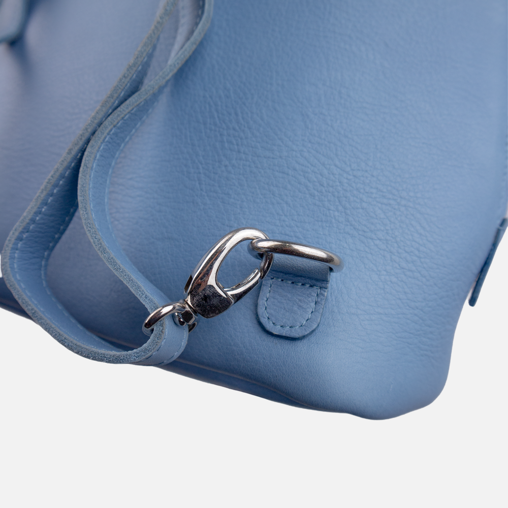 Close up view of the Hedgehogs ladies convertible backpack, showing the removable and adjustable strap hardware.