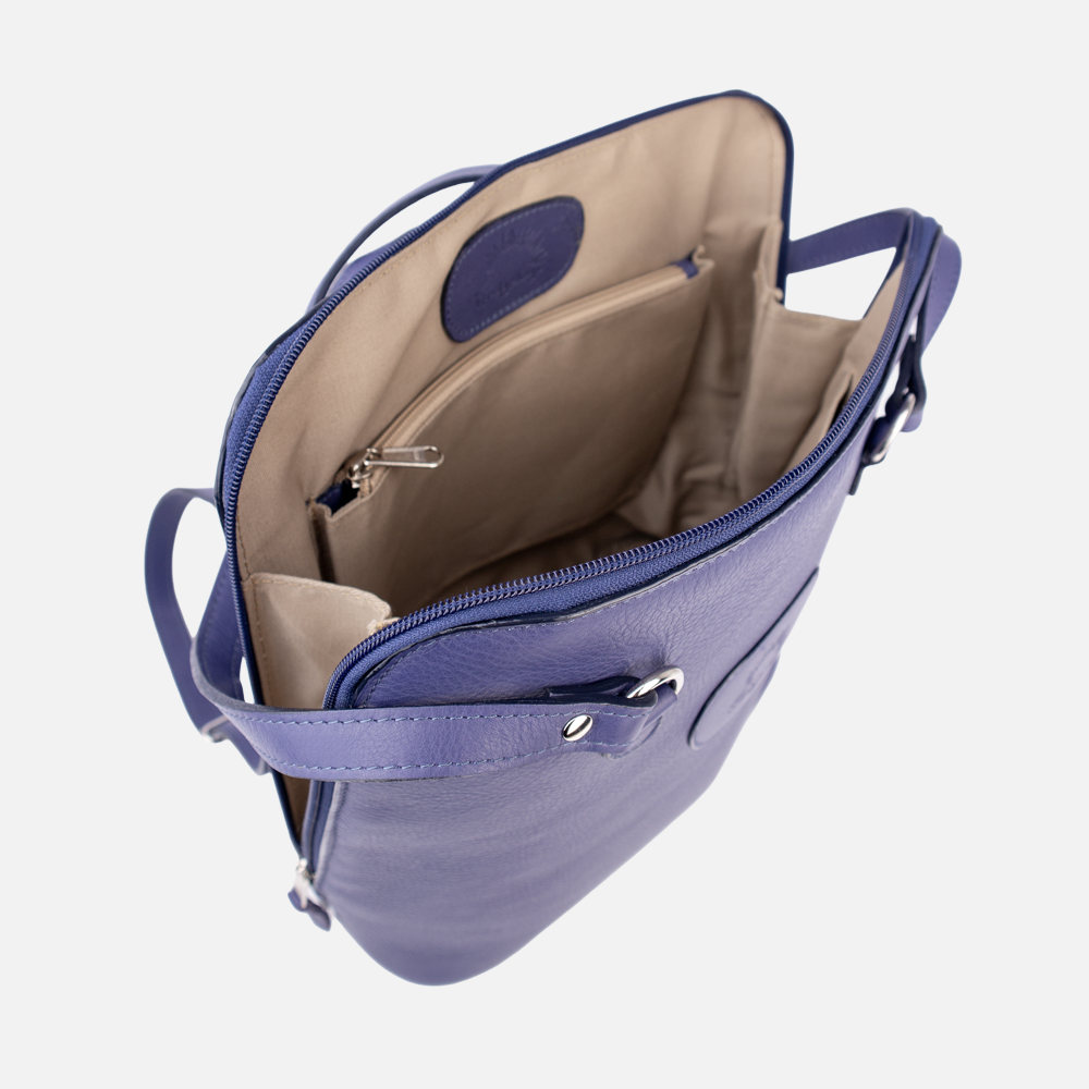 Internal view of the Hedgehogs indigo leather convertible backpack, showing the inner pockets and lining. 