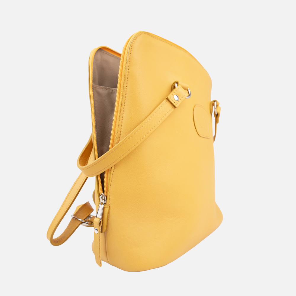 Side view of the Hedgehogs ladies convertible backpack in ochre yellow full grain leather, showing side zipper detail. 