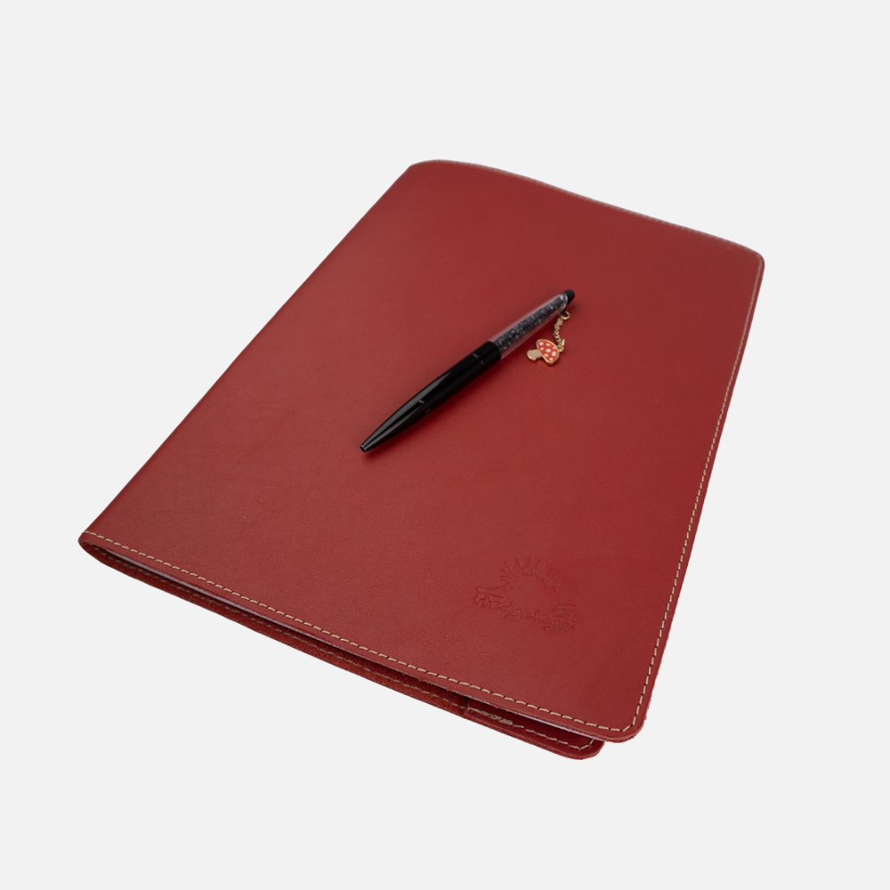 Additional view of the Hedgehogs full grain leather A4 notebook cover in coral leather. 