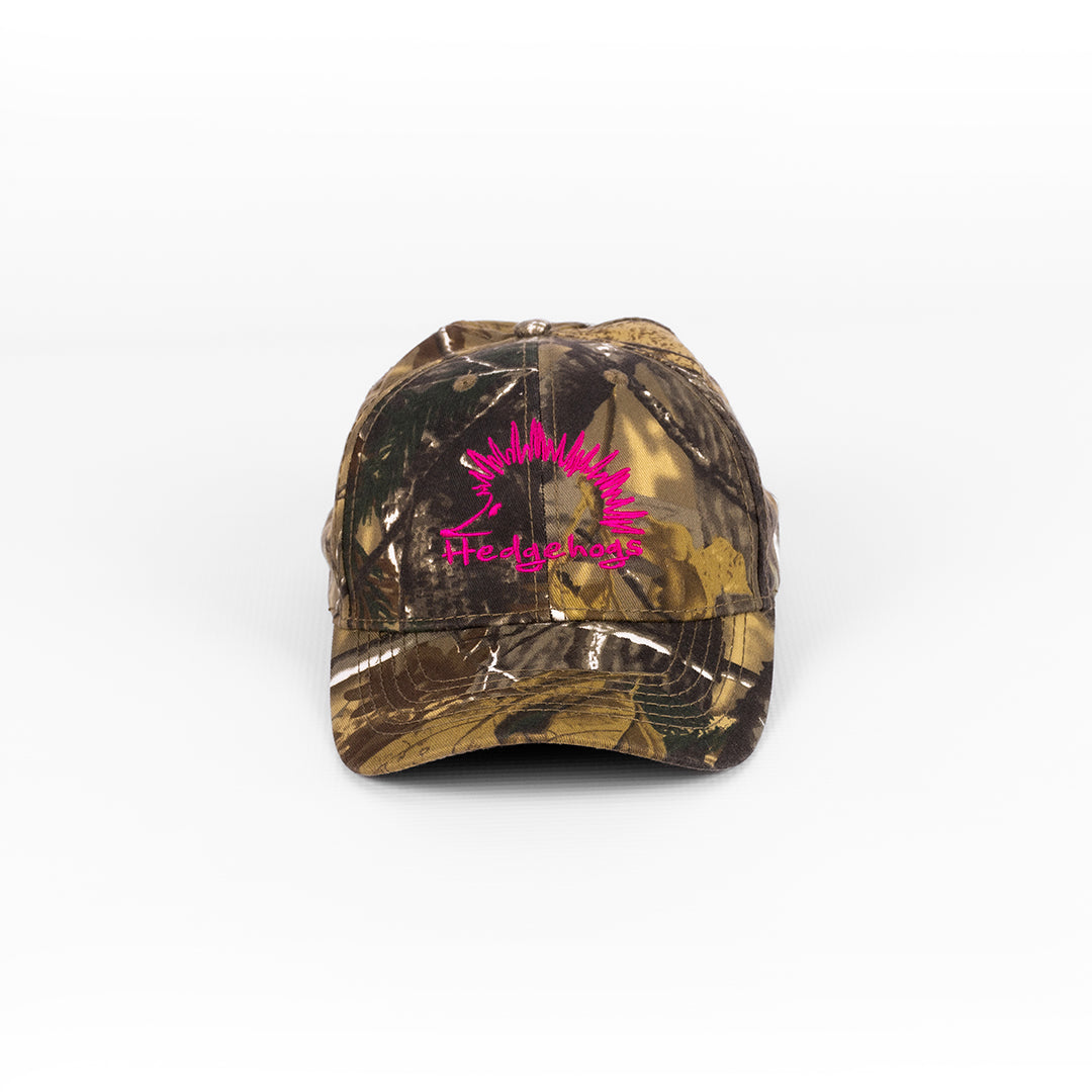 Front view of the Hedgehogs Cotton Twill Cap in Camouflage print with cerise pink front logo embroidery.