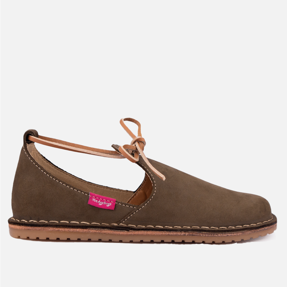 Side view of the Hedgehogs Milah casual leather loafer-style flat shoe in Olive Nubuck, showing leather tie detail.