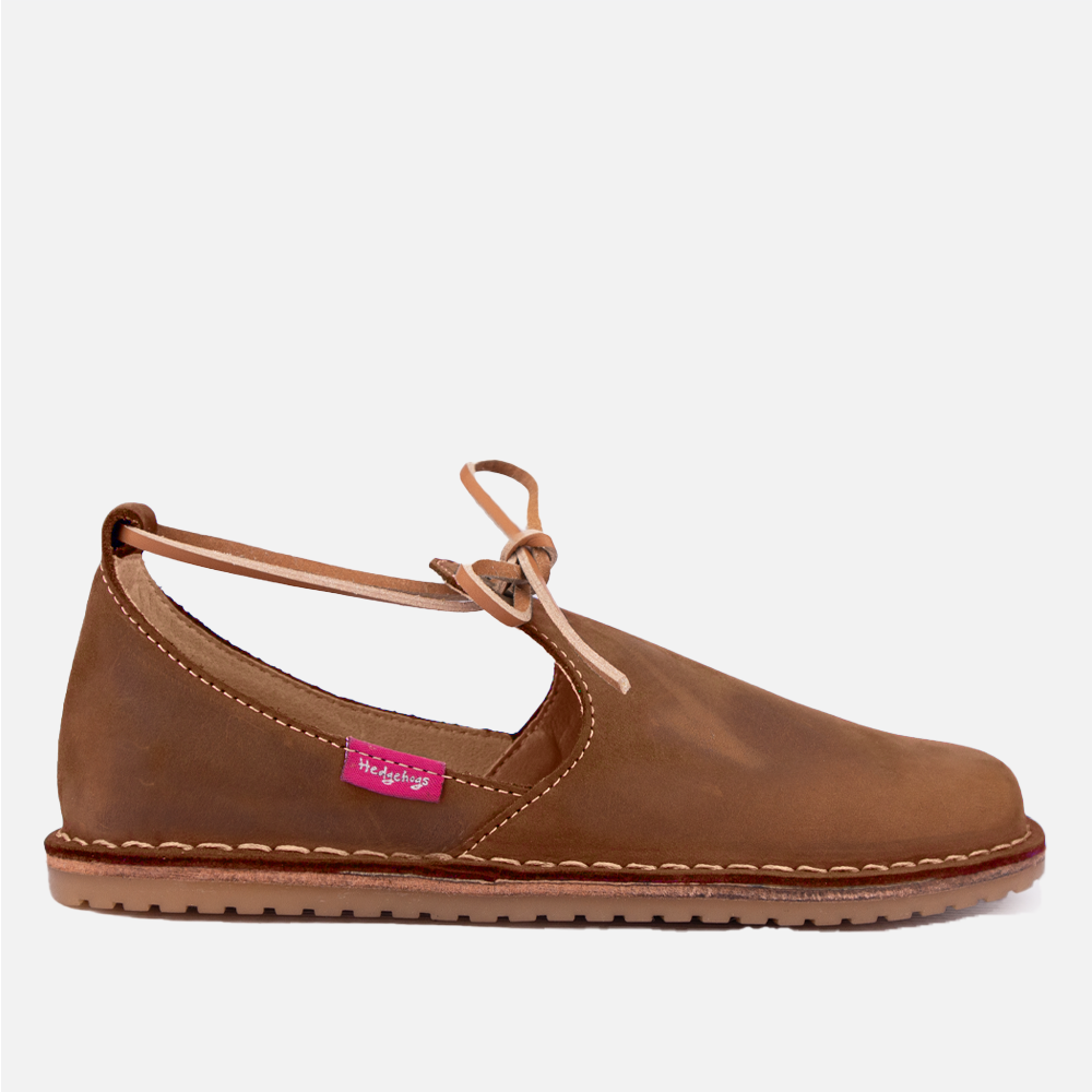 Side Profile of the Hedgehogs Milah shoe, a ladies casual leather loafer with leather lace detail. 