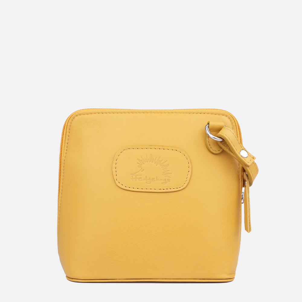 Front view of the Hedgehogs clutch bag in ochre leather showing the brand embossing and strap detail.