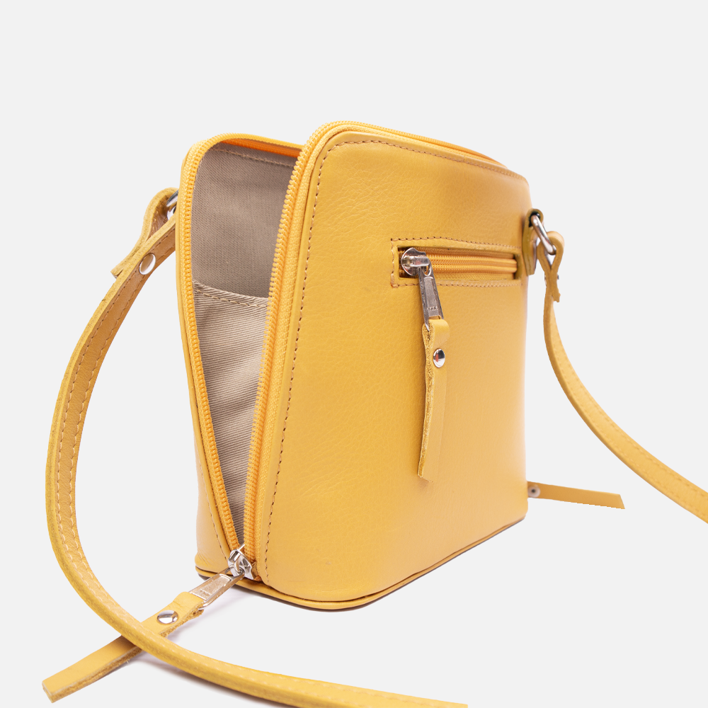 Side view of the Hedgehogs clutch bag in ochre leather, showing the zip detail and closure, strap and external pocket detail. 