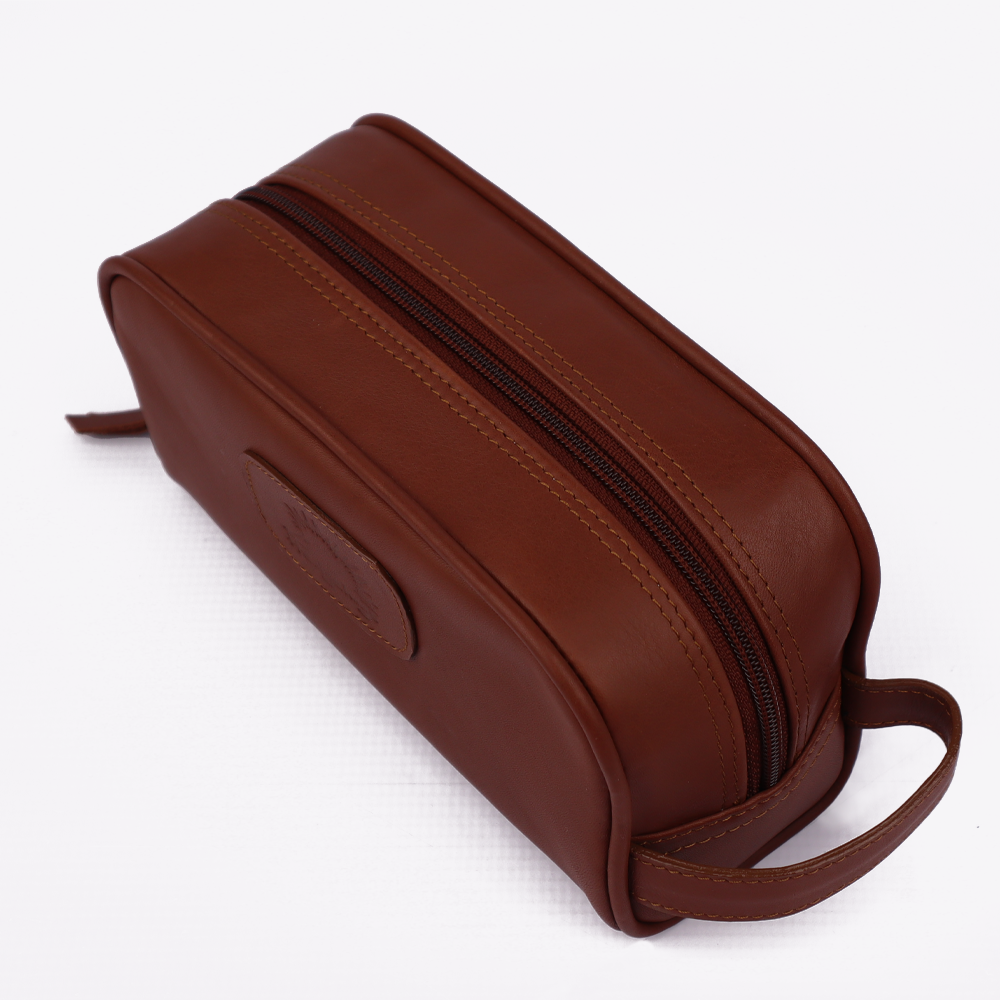 Top view of the Hedgehogs ladies toiletry bag in chocolate brown leather, showing top zip closure. 