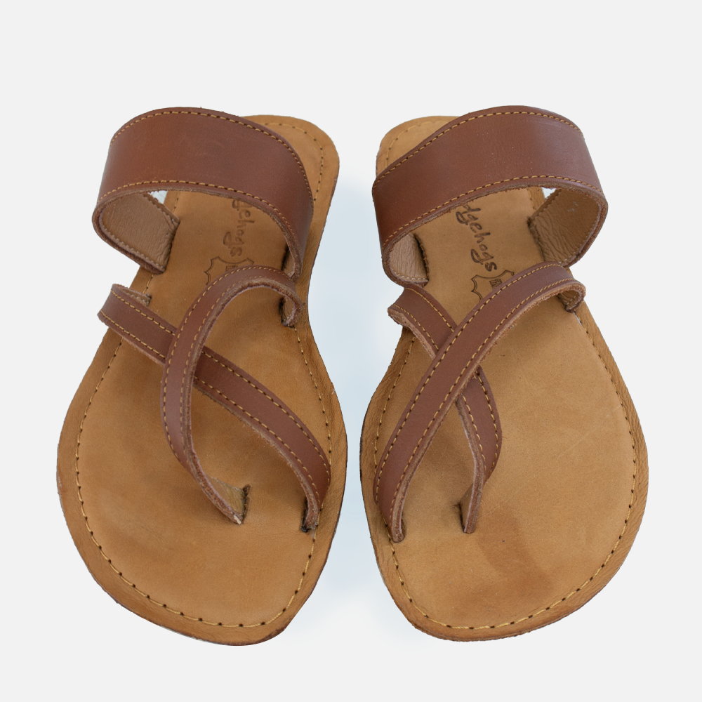 A pair of Hedgehogs Wendy leather sandals showing the cross-over toe strap detail.