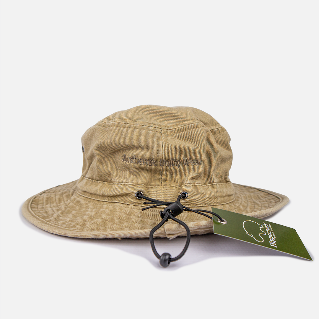 Close-up detail showing the brass ventilation eyelets and the adjustable cord on the Khaki bush hat.