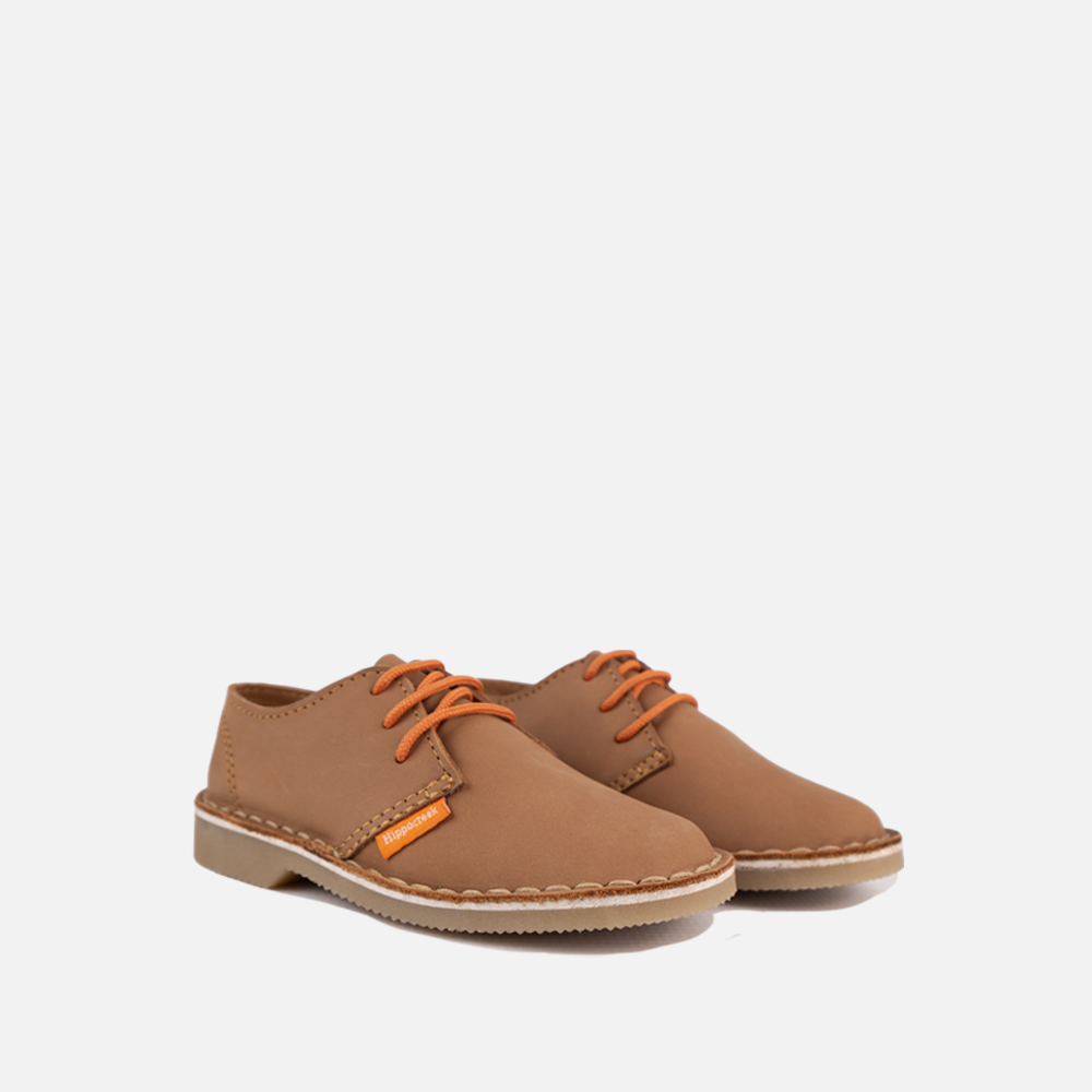 View of the HippoCreek Jackal Shoe for children showing tan leather and orange laces.