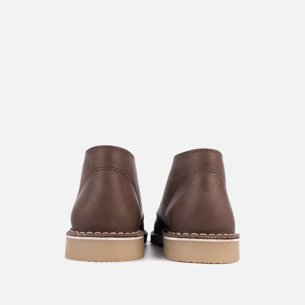 View of the high-traction, non-slip rubber sole on the HippoCreek Youths Lemur Mid Boot, built for utility and outdoor use.