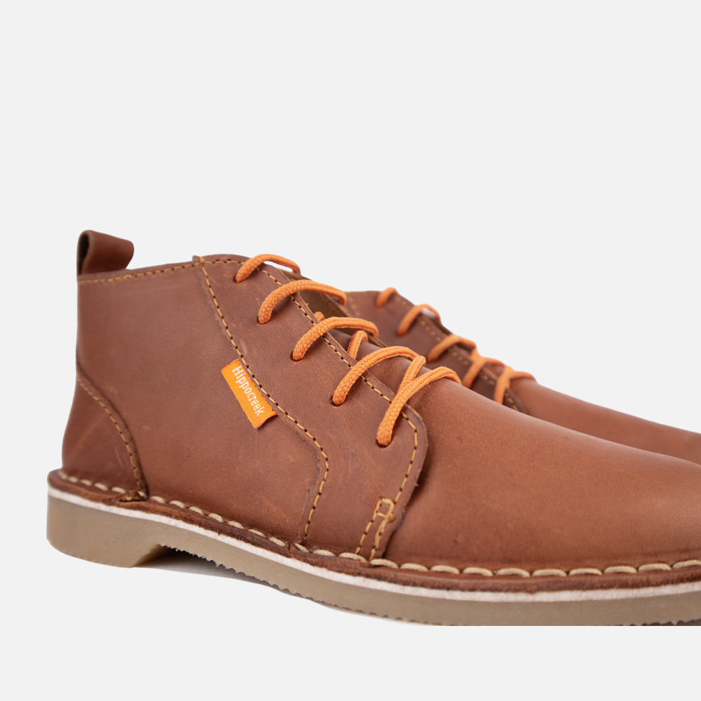 Close-up view of the sturdy lace-up closure and high-quality Cognac genuine leather of the HippoCreek Youths Owl Leather Boot.