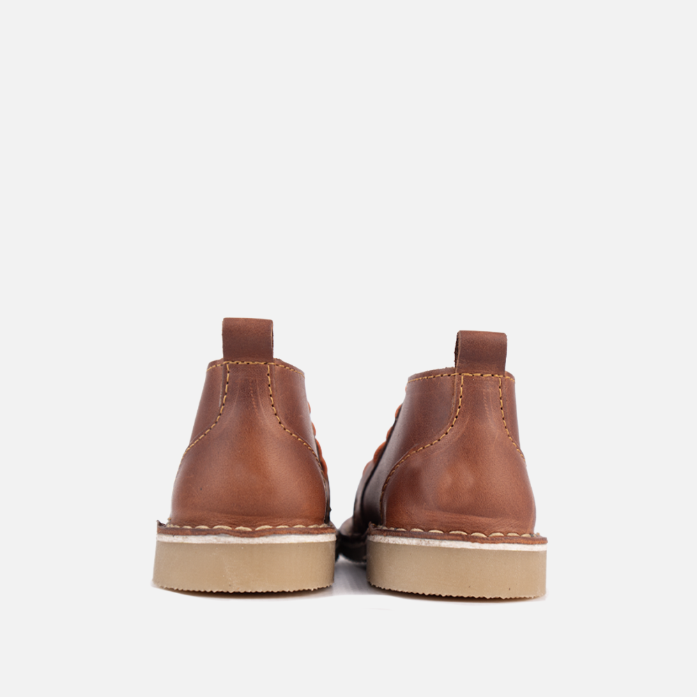 View of the high-traction, non-slip rubber sole on the HippoCreek Youths Owl Boot, built for rugged utility.