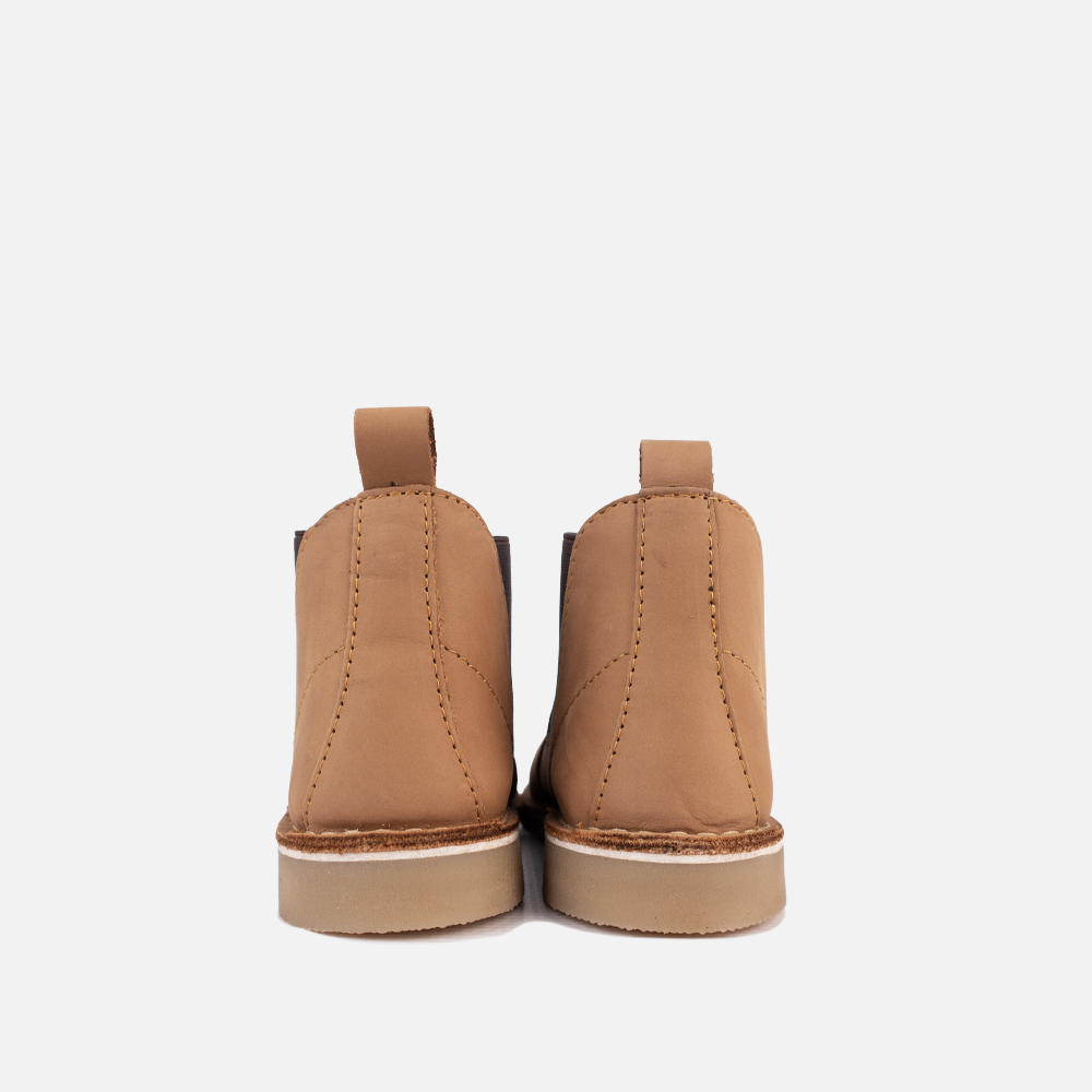 View of the high-traction, non-slip rubber sole on the HippoCreek Youths Possum Boot, built for rugged utility.