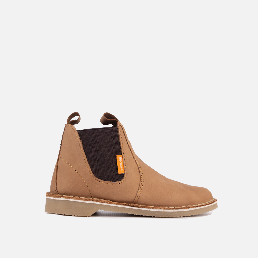 Side view of the HippoCreek Youths Possum Leather Boot in Santiago Dark Choc, a durable youth genuine leather slip-on utility boot.