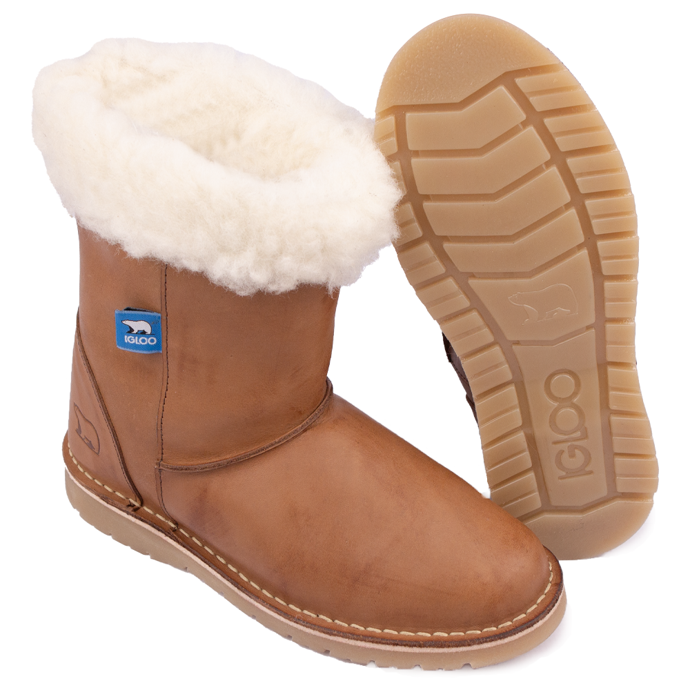 Detail view of the Igloo Tundra Boot in Tan, showing the branded sole and sheared sheeps and lambswool lining and collar.