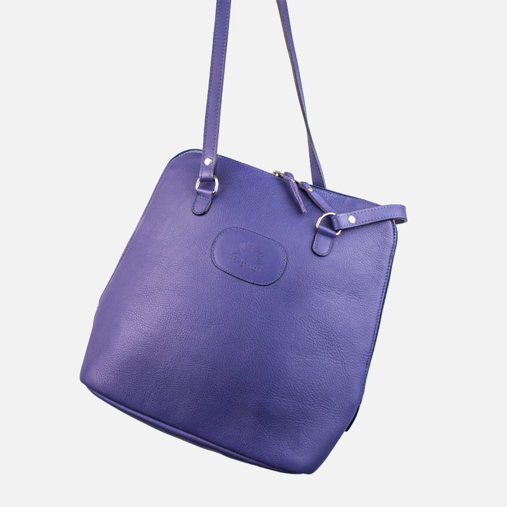 The Hedgehogs Indigo Convertible Backpack shown transformed into a shoulder or cross-body bag with adjusted straps.