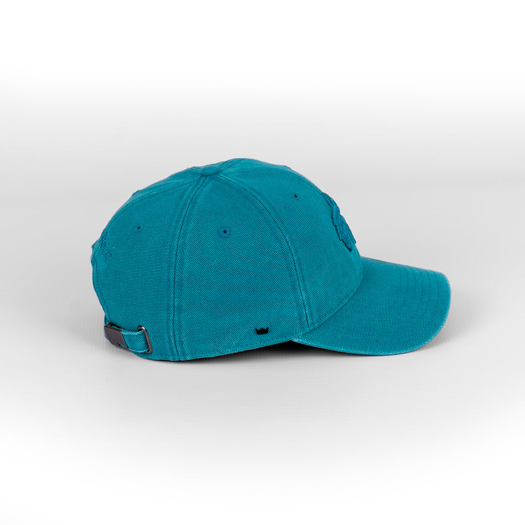 Angled view showing the curved peak and canvas texture of the Mint Blue U-Flex cap.