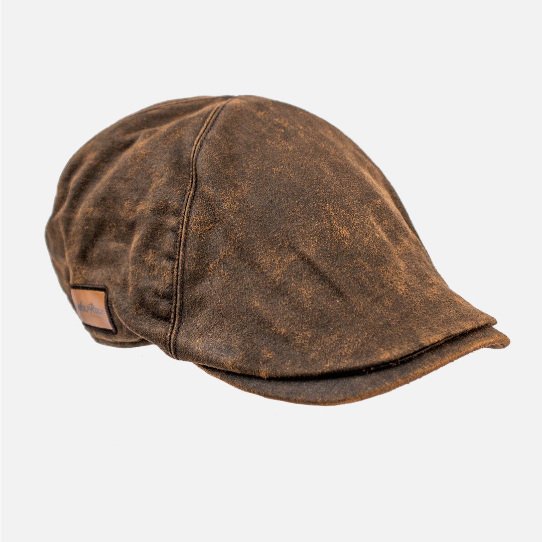 Side profile of the Oilskin Flat Cap, highlighting the classic shape and waterproof material.
