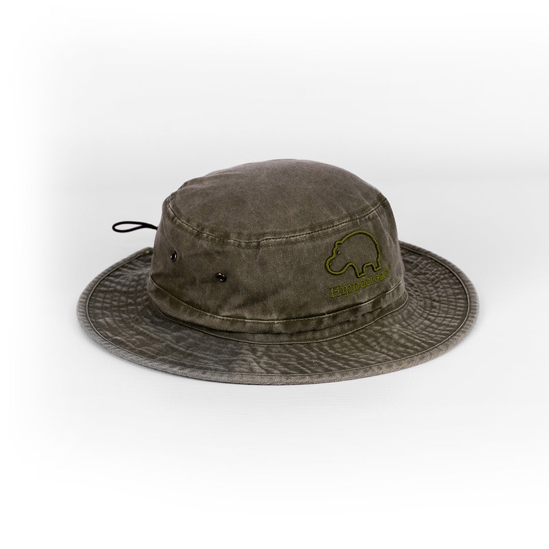 Angled view showing the wide brim and the rugged, distressed texture of the Olive bush hat.