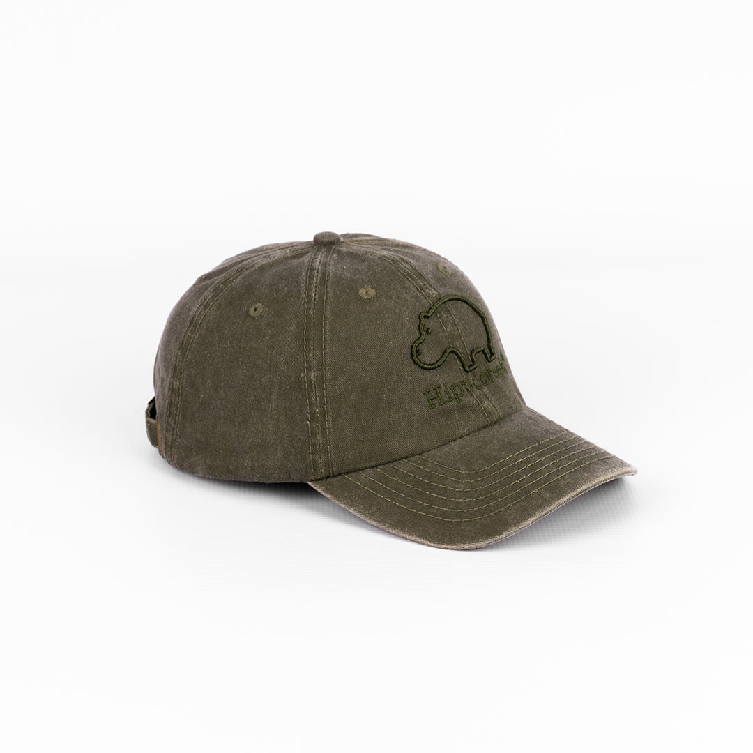 Angled view of the HippoCreek Olive cap, showing the curved peak and soft texture.