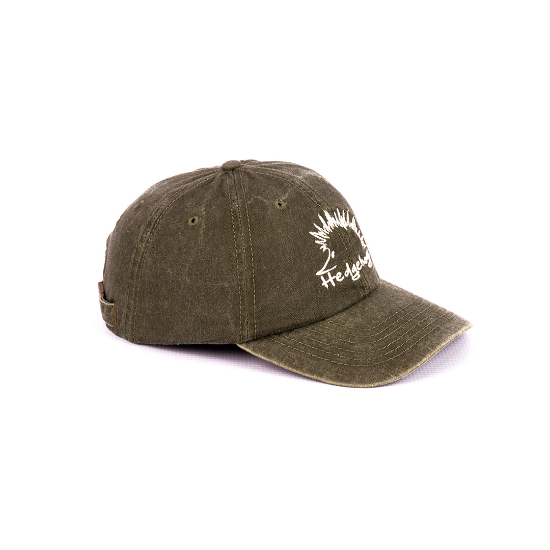Side profile of the Olive Washed Cotton Cap, showing the relaxed shape.