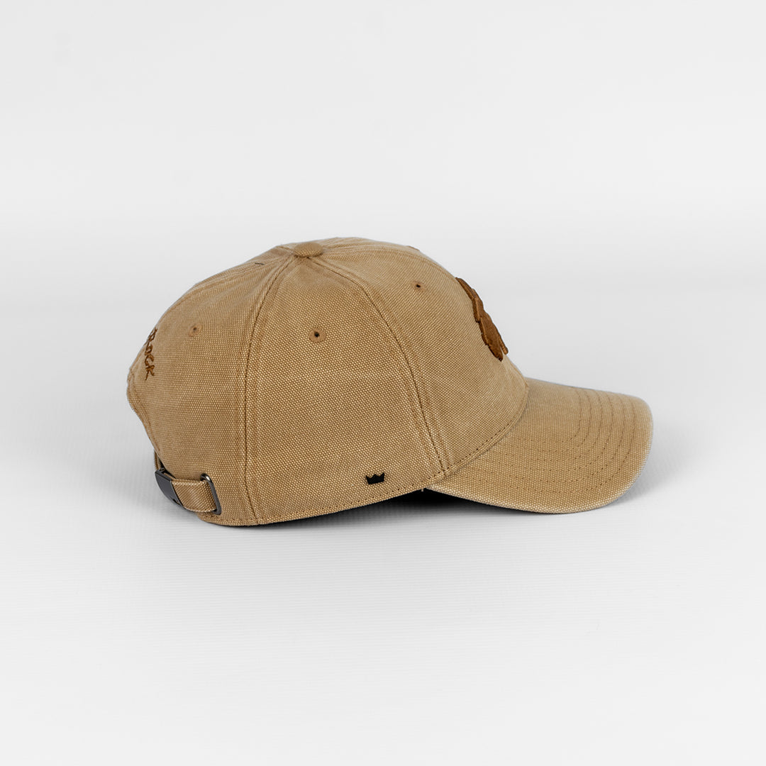 Close-up detail of the durable Canvas fabric texture on the Tan cap.