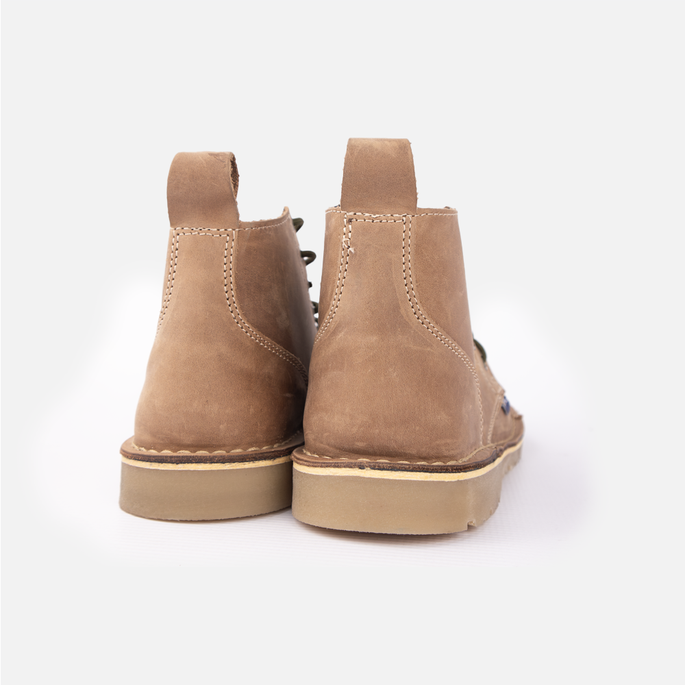 Rear view of a pair of Wolf Rock Baxter Boots in Houston Stone Leather, showing contrast stitching up the heels.