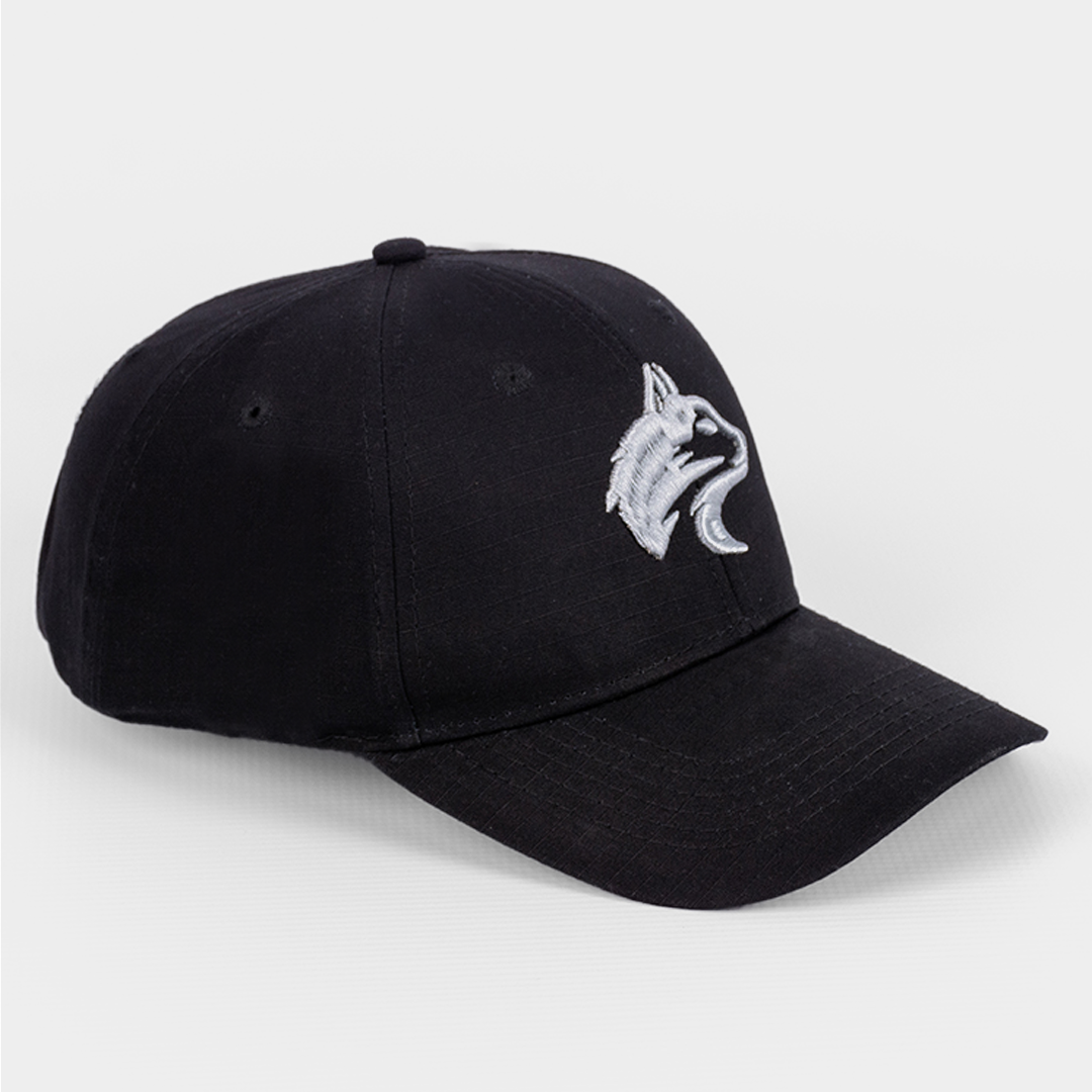 Angled view showing the shape and structured peak of the Black Rip Stop Cap.