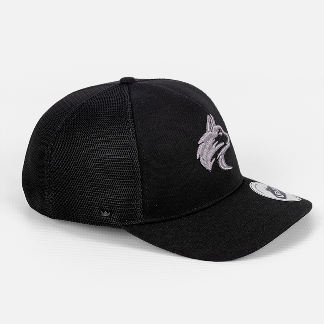 Side profile of the Black Wolf Rock U-Flex Trucker Cap, highlighting the fit and contrast materials.