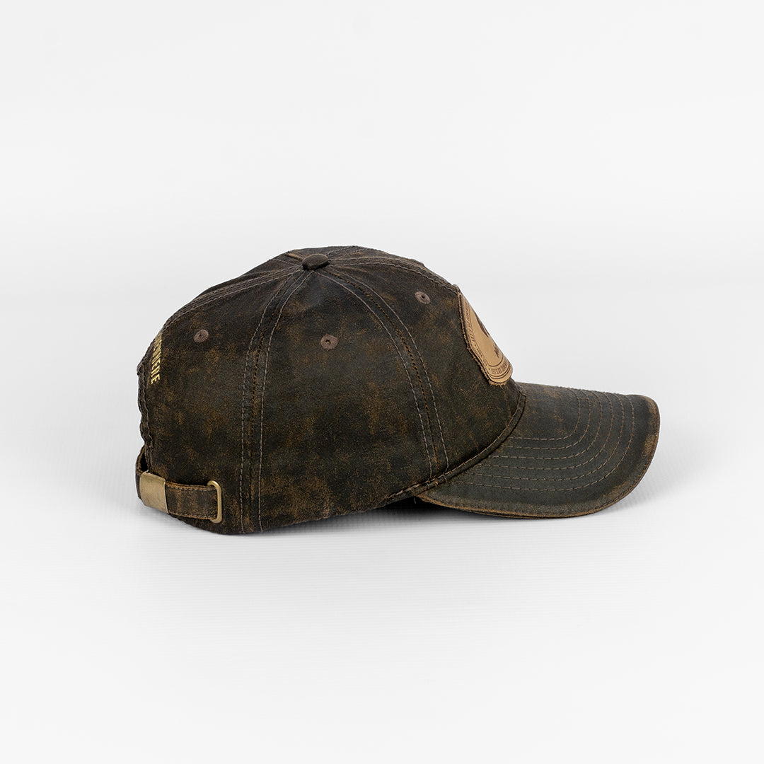 Side profile of the Wolf Rock Brown Oil Skin Leather Patch Cap.