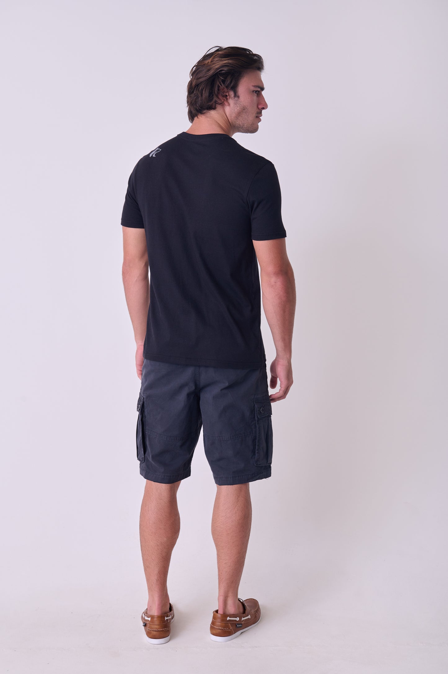 Rear view of the Wolf Rock Icons Tee in Black, featuring the subtle logo print on the back shoulder.