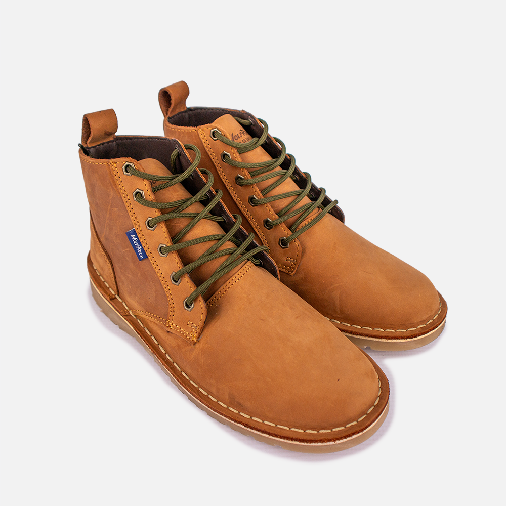 Top view of a pair of Wolf Rock Jason Boots in a rich tan leather, highlighting the lacing and tongue construction.